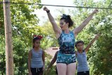 Lemoore's Cayleigh Snow leads youth participants Ariel and Kayla in instruction at Saturday's (July 22) Youth Cheer Camp.